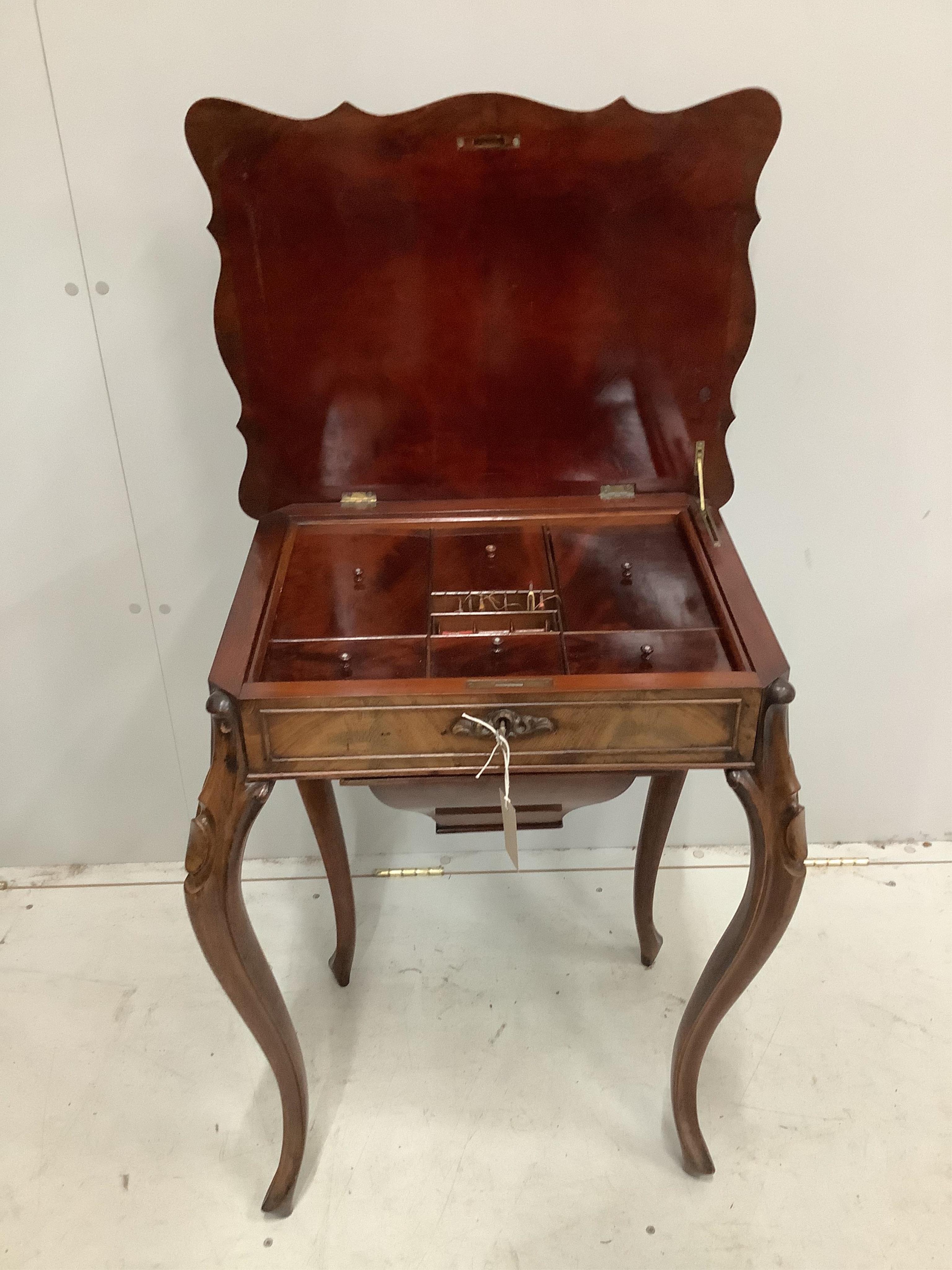 A 19th century French mahogany work table, with fitted interior and silks box, width 57cm, height 75cm. Condition - good